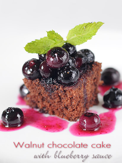Walnut chocolate cake with blueberry sauce